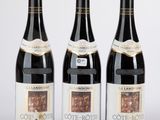 trois bouteilles de vin posées l'une à côté de l'autre sur une table