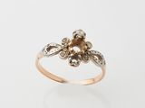 an image of a gold and diamond flower ring