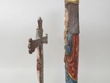 two figurines that are standing next to each other