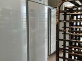 a white refrigerator and a white refrigerator freezer in a kitchen