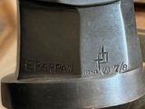 a close up of a black stove top with a clock on it