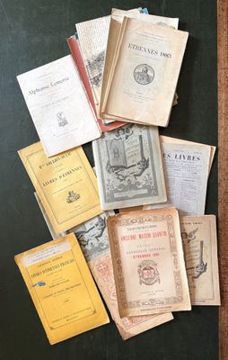 many old books on a table with a wooden frame