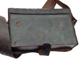 an old leather bag with a strap on it
