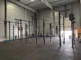 a gym with a lot of equipment inside of it