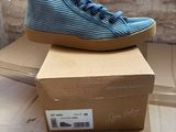 a box with a pair of blue shoes on top of it