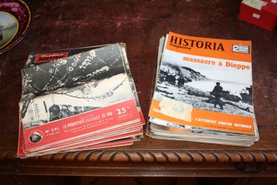two books sitting on a table next to each other
