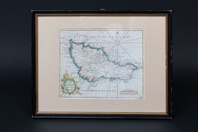 an old map of ireland in a frame on a black background