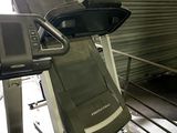 a tread machine that is sitting in a garage