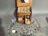a small wooden jewelry box with a mirror on top of it
