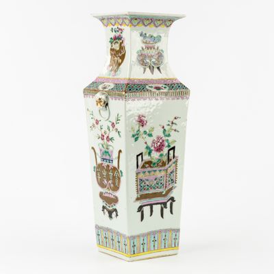 a large vase with a bird and flowers on it