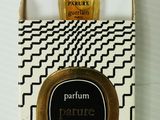 an image of a bottle of perfume sitting on top of a box