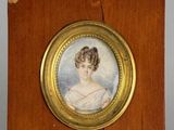 portrait of a woman in a white dress in a wooden frame