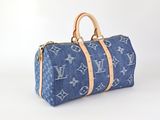 Sac Louis Vuitton en denim bleu avec des anses en cuir beige