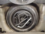 a spare wheel in the back of a car