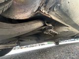 a close up of a car ' s exhaust pipe and exhaust pipe