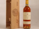 an image of a bottle of wine sitting next to a wooden box