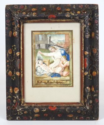 un vieux cadre contenant le portrait d'une femme et d'un enfant