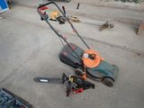 a lawn mower that is laying on the ground