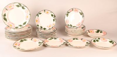 a lot of plates that are sitting on a table