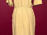 an image of a dress on a mannequin stand
