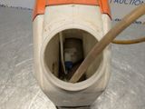 a toilet with a plunger and a hose in it