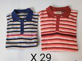 two polo shirts, one red and one blue, are sitting on a white surface