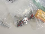 a small toy car in a plastic bag on a table