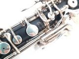 a close up of a silver and black clarinet