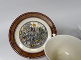 a cup and saucer sitting next to each other on a table