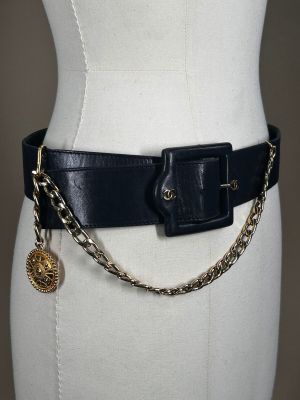 a close up of a mannequin torso wearing a belt with a chain around it