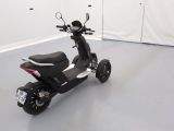 a scooter that is parked in a room