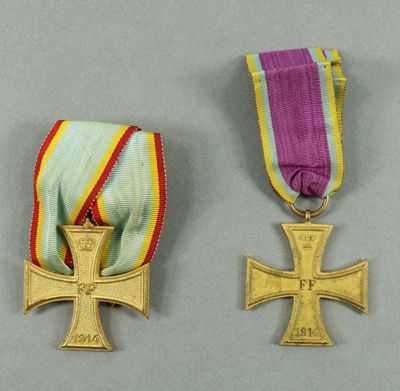 two medals of the order of merit and the order of the cross