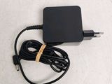 a black charger that is plugged into the wall