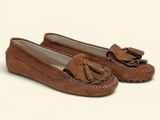tan sued slippers with tassels on the toes