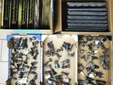 a lot of screws in a box on a table