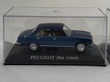 two model cars in a display case on a white surface