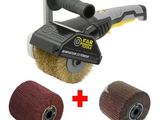 a close up of a sander with a brush and a roll of cloth