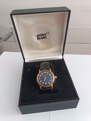 an image of a watch in a box on a table
