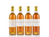 three bottles of wine sitting next to each other on a white surface