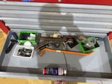 a tool box with tools and a can of soda in it