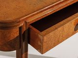 a small wooden table with a drawer underneath it