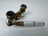 a pair of brass pipes that are sitting on a table