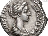 a silver coin with an image of a woman wearing a wreath on it