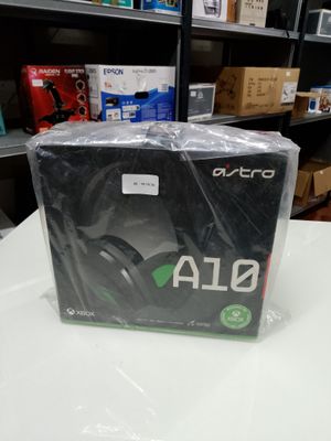 a box of gaming headsets on a table in a store