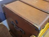 two old suitcases sitting next to each other on the floor