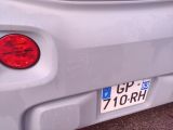 a close up of the rear end of a car with a license plate