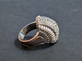 an image of a silver ring with a pearl in the center