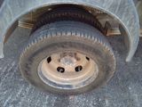 a close up of a flat tire on a truck