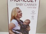 the box of the baby carrier is sitting on the table