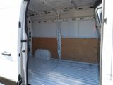 a white van with a bed in the back of it